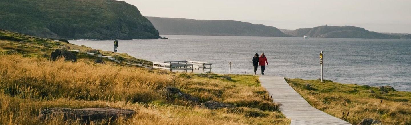 Landscape photo with a path leading to a view of the sea